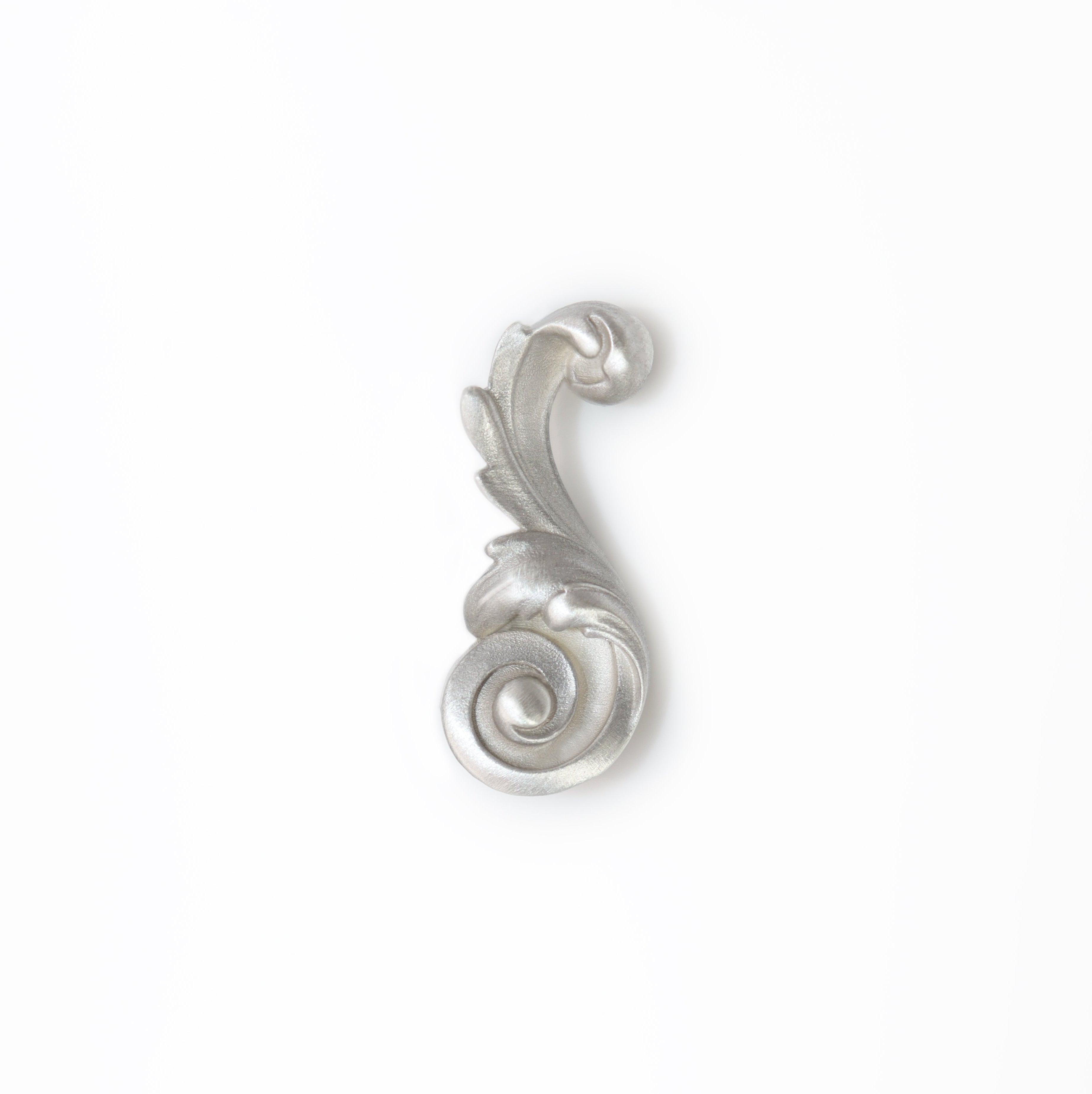 Silver decorative Acanthus leaf brooch on a white background