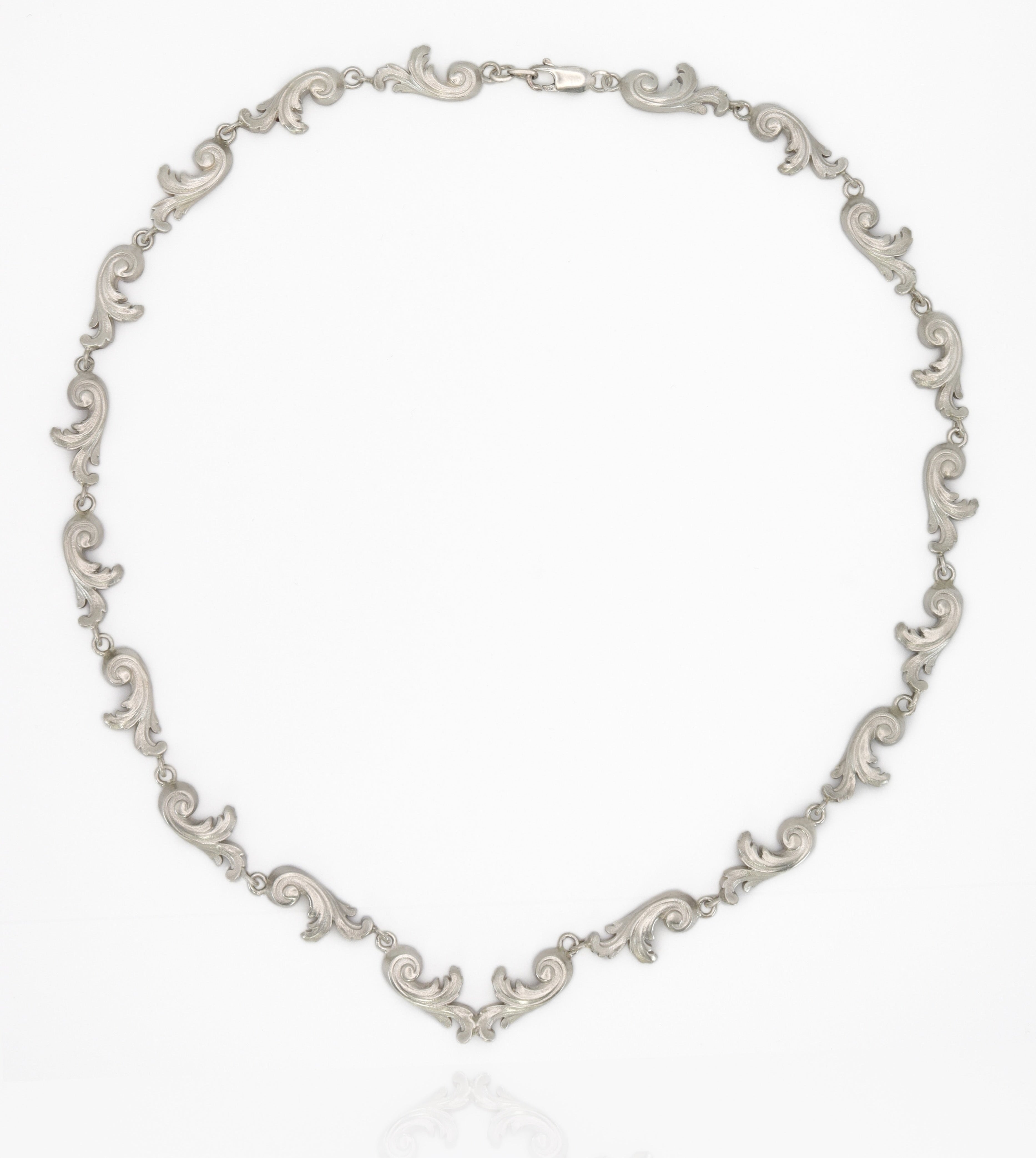 Silver necklace on a white background