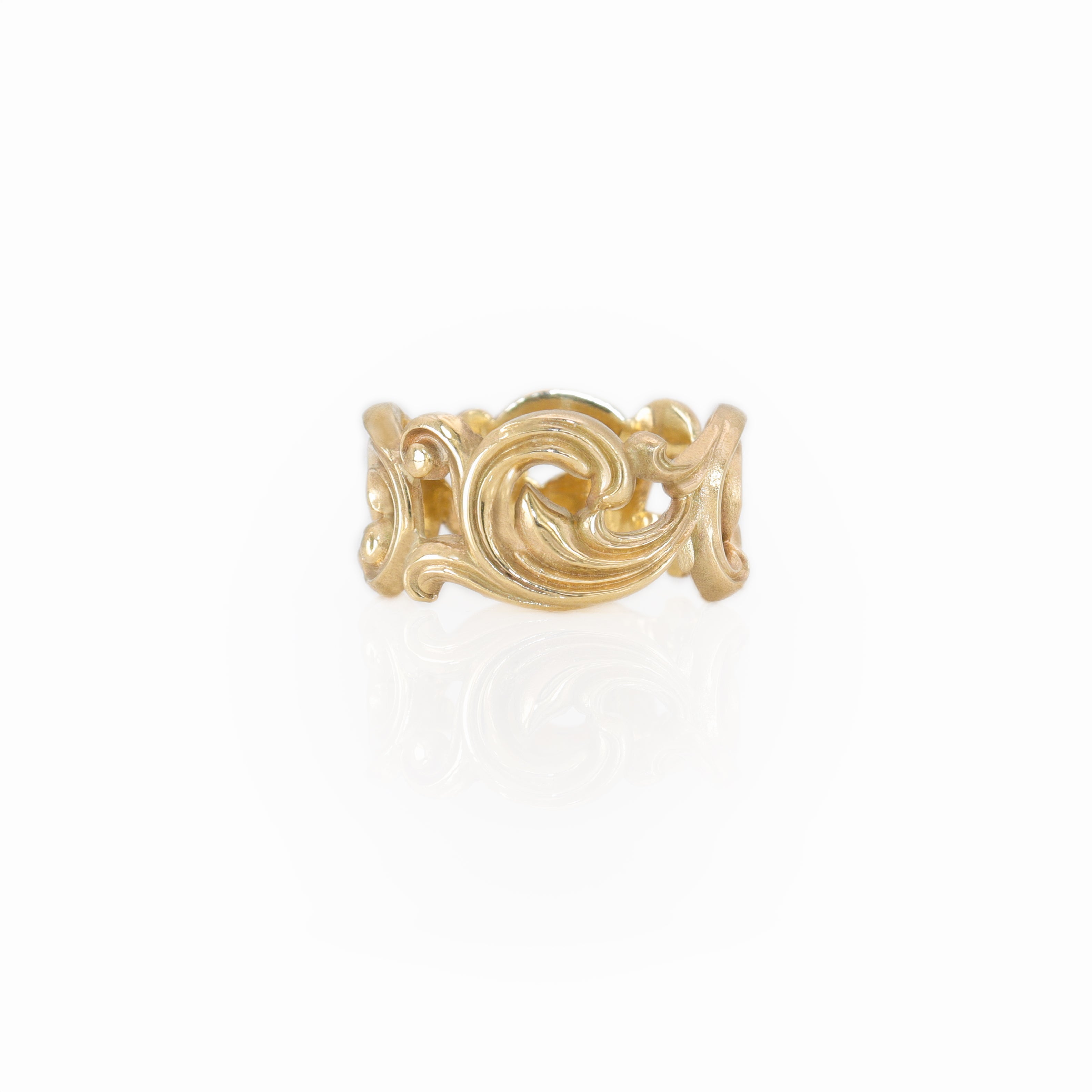 Gold SCROLL ring with a white background